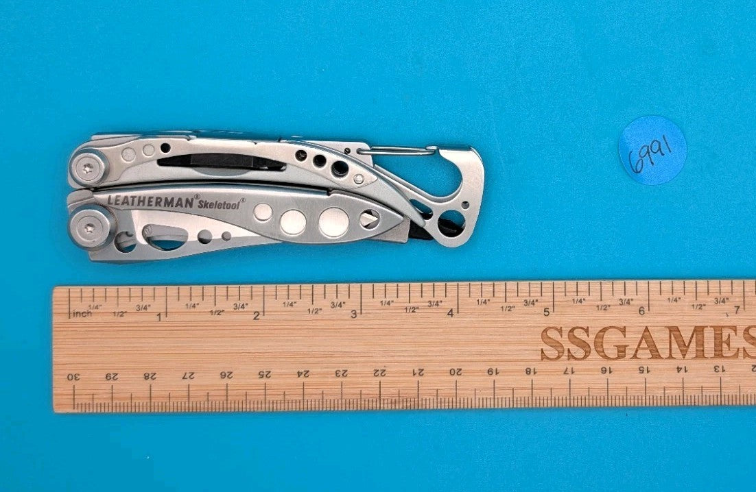 LEATHERMAN Skeletool Multi Tool - Combo Edge Blade Knife Pliers Carabiner!!!