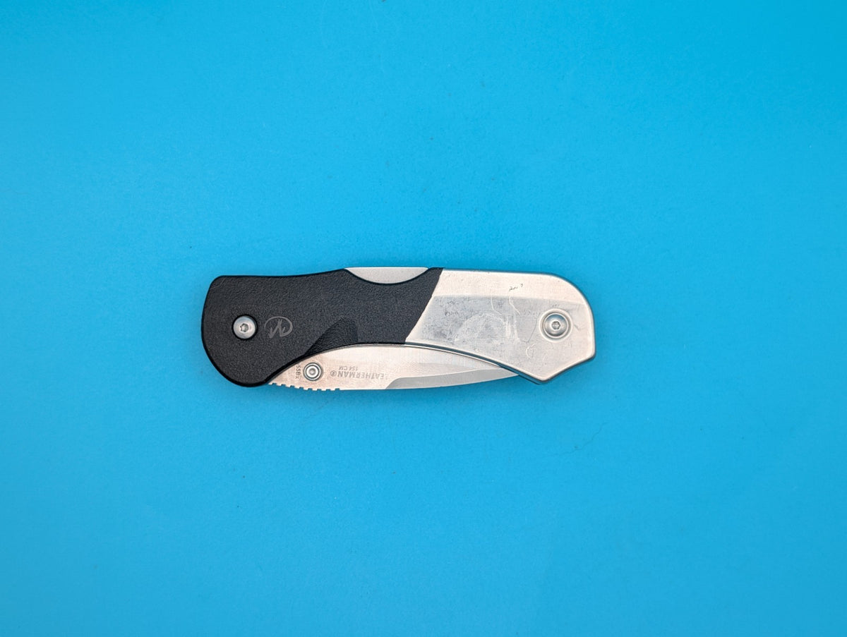 Retired Leatherman E55BX 154CM Blade Combo Edge Folding Pocket Knife!