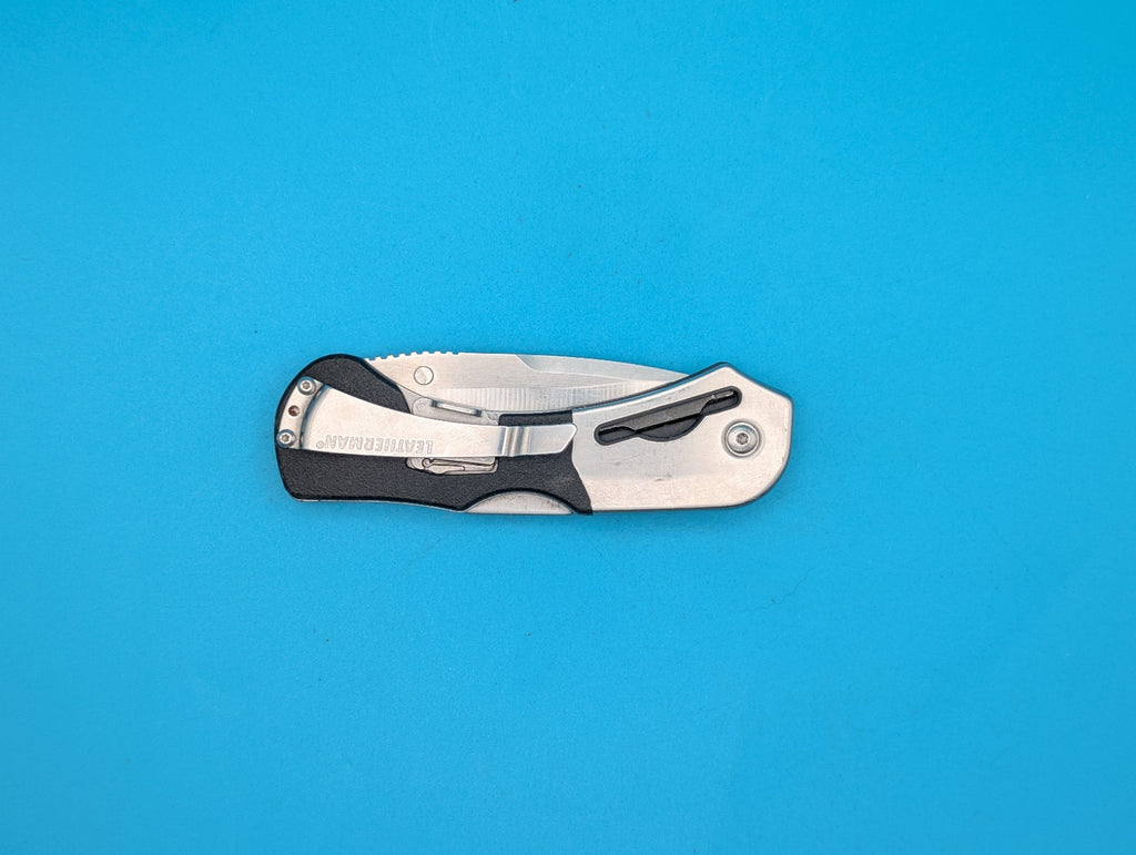 Retired Leatherman E55BX 154CM Blade Combo Edge Folding Pocket Knife!
