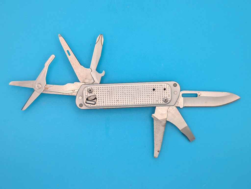 Leatherman FREE T4 Pocket Knife Multi-tool! Stainless! RETIRED!