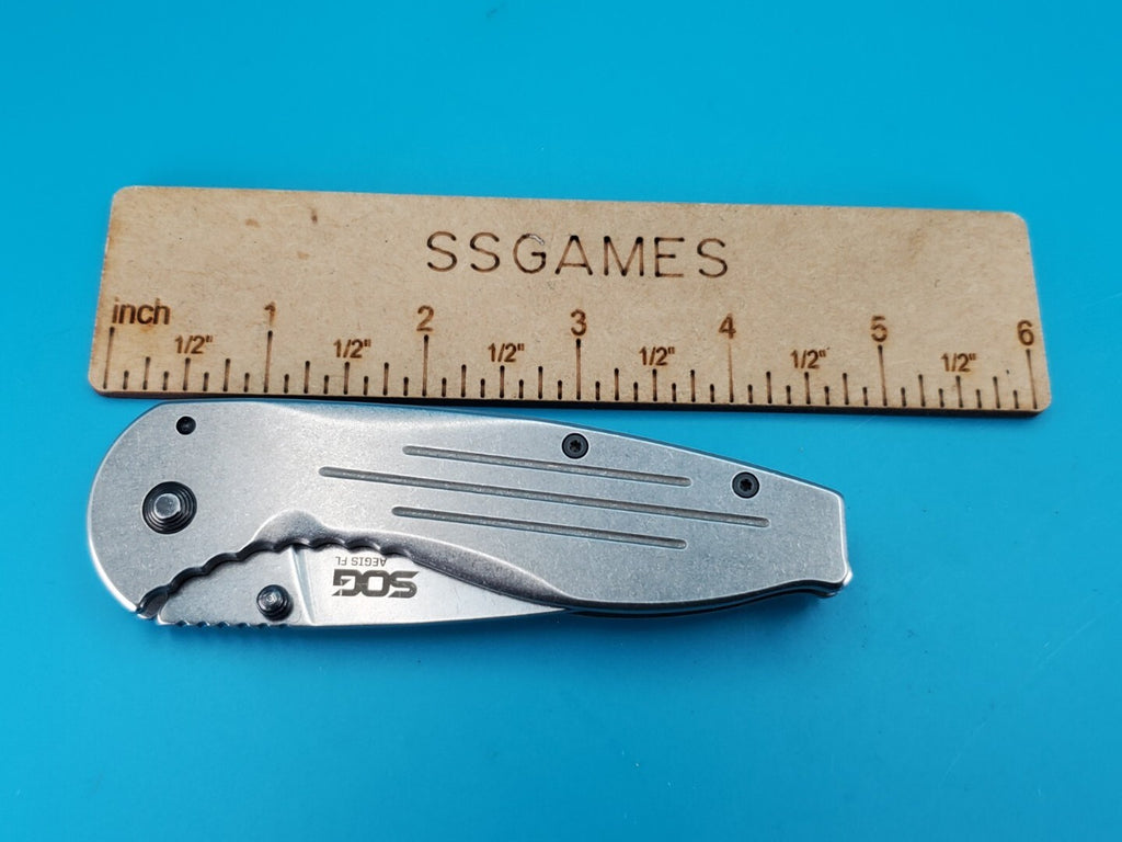 SOG Aegis FL Flipper Knife Frame Lock Plain Edge Blade!